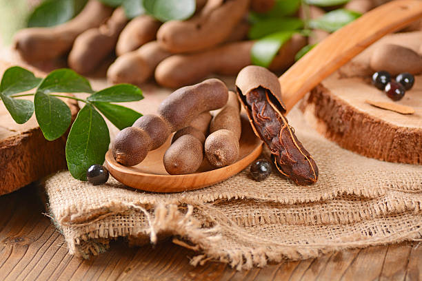 tamarind fruit on wooden table