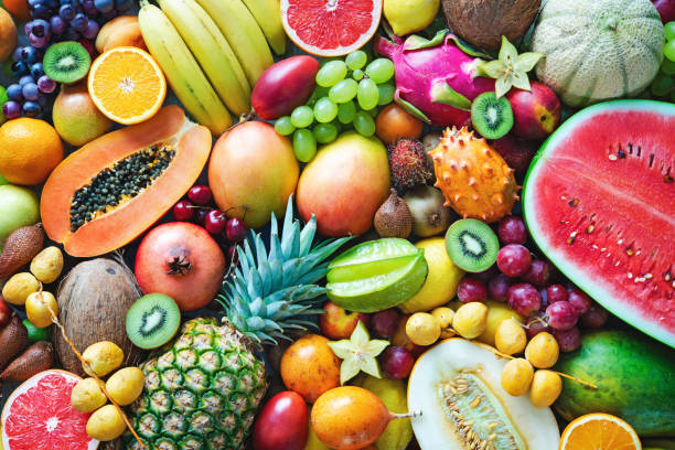 Food background. Assortment of colorful ripe tropical fruits